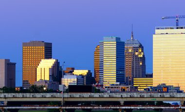 Downtown OKC at sunset, how to save on Oklahoma car insurance blog