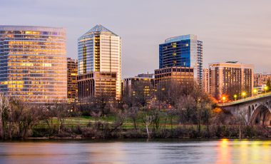Rosslyn, Arlington, Virginia, USA city skyline on the Potomac River, how to save on Virginia car insurance guide background