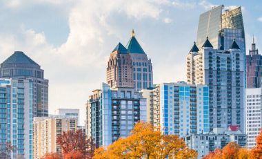 Atlanta skyline background for georgia car insurance laws guide