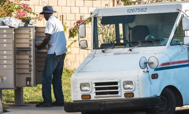 car insurance for postal employees delivering mail to mailbox