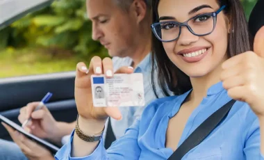 Girl is holding new insurance ID card after getting temporary car insurance in arizona.